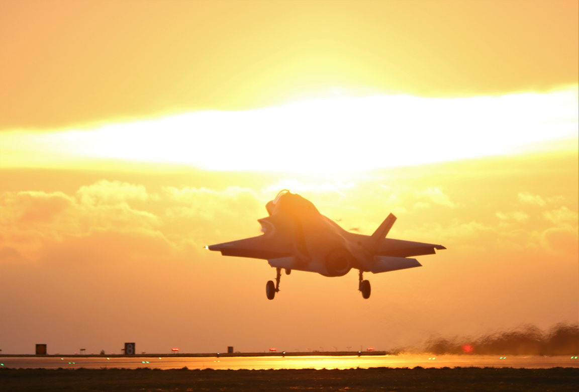 Image shows RAF Typhoon taking off into the sunset.